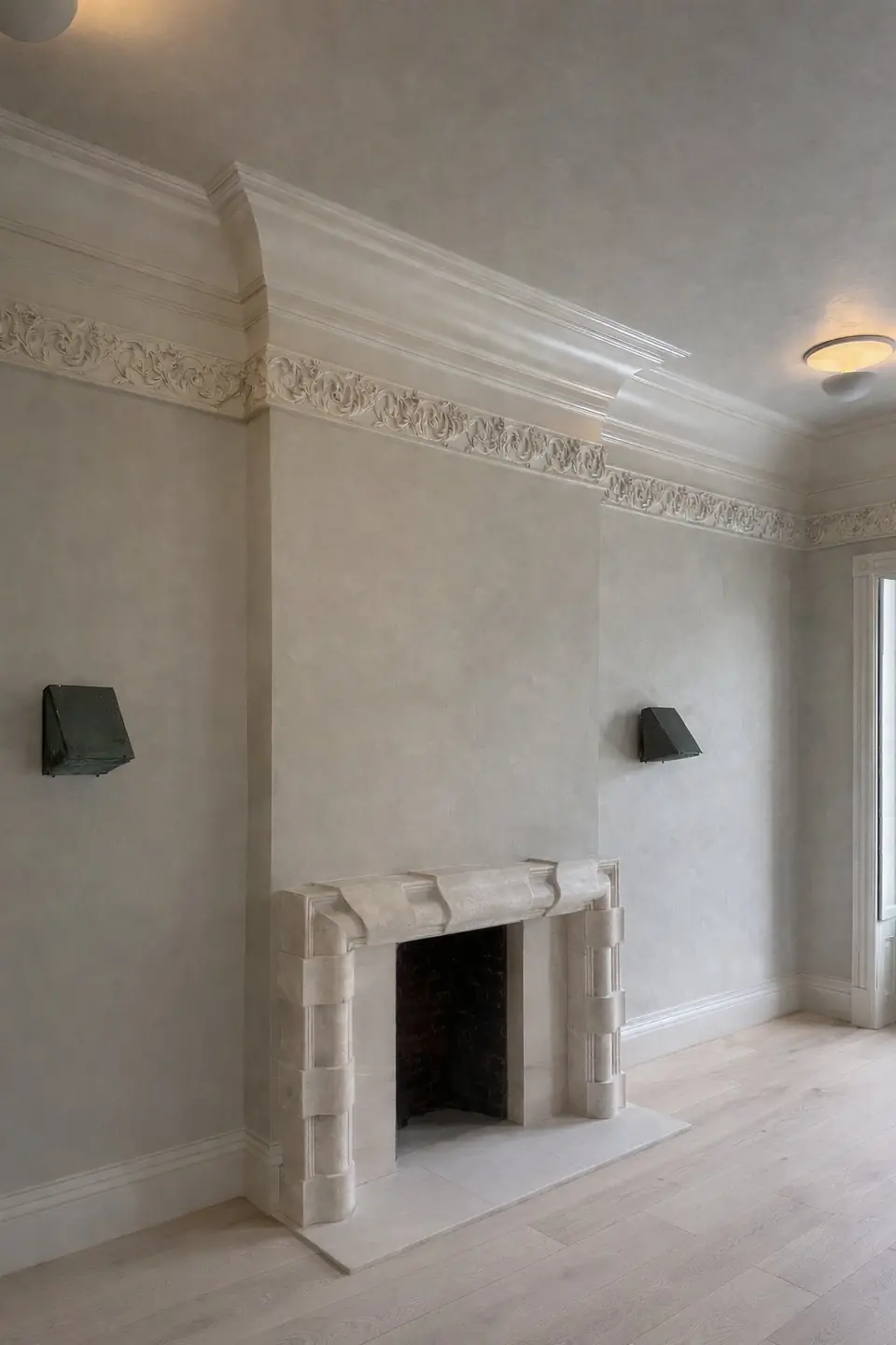 PLST 44 plaster flush mount by Brendan Tadler, installed in a room with a limestone fireplace, plaster walls and ornate cornice